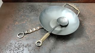 A handmade 12in Western Heavy wok and spadle ready for seasoning!