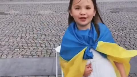 Little Solomiya from Dnipro plays the flute in the city center