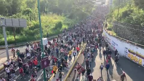 MASSIVE Migrant caravan steamroll over police roadblock in Mexico - Heading for the U.S. 1