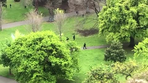 Melbourne, Australia: Ariel view of marxist police opening fire on anti clotshot mandateprotesters.