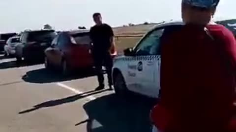 Russian woman yelling at men running to Kazakhstan