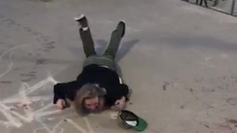 Skateboarder tries trick while drinking beer and falls hard