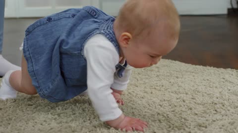 Baby Girl Crawling On The Floor , watch it