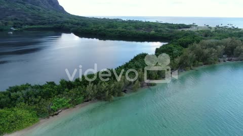 Flying above the natural wall between the ocean and traditional Hawiian fishpond