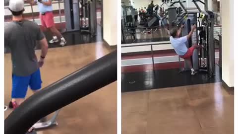 Man in pink shorts funny gym workout