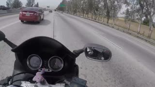 Merging Car Send Motorcycle Into Tiny Gap