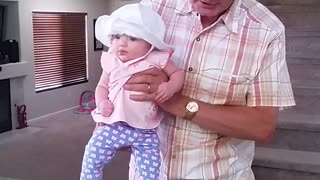Grandpa Sings Song As He Helps Baby Dance