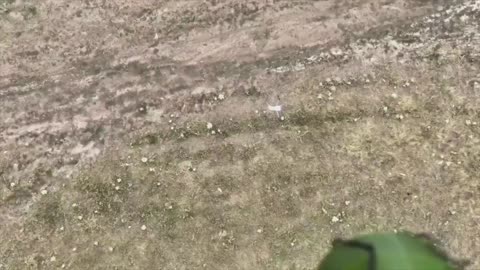 A Ukrainian Drone Drops a Grenade onto a Russin One