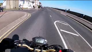 Cyclist Cuts into Road in Front of Motorcycle