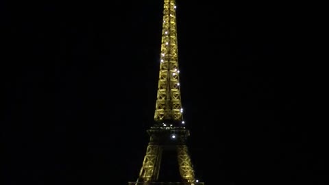 Eiffel Tower in a beautiful night with a romantic music