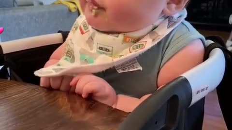 baby enjoying his meal