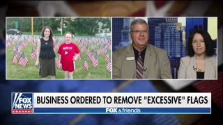 Business fights town order, says even 2,000 flags would not be 'excessive'