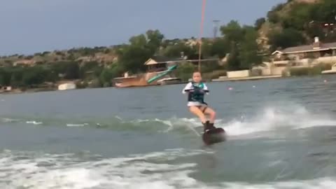 Collab copyright protection - young girl water skis belly flop