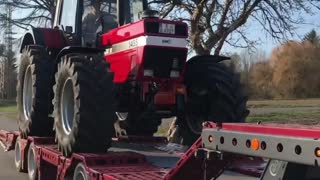 Loading Case IH 1455 on Trailer - truck transport