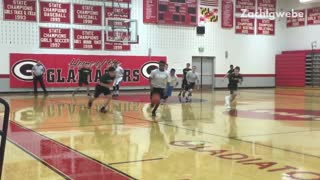 Student in grey shirt falls during basketball game