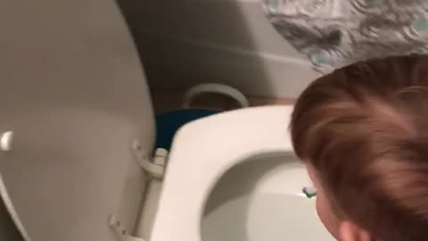 Boy Brushes Teeth With Toilet Water