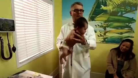 A doctor showing how to stop a crying baby