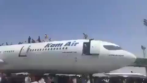 Afghans Climb on top of Departing Plane in Kabul during US Evacuation