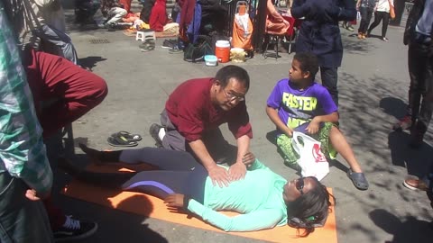 Luodong Massages Cute Black Woman On Sidewalk