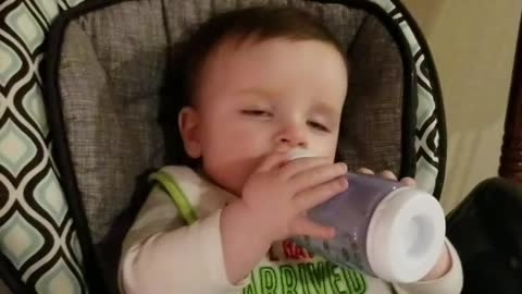 Baby falls asleep drinking his bottle
