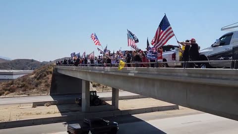 Freeway overpass in California is full of Trump supporters.