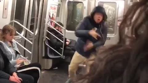 Blue hoodie guy dances and jumps in subway car