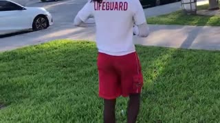 Guy white lifeguard shirt backflip on grass fail