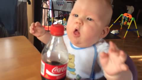 Baby tries Cola for the first time