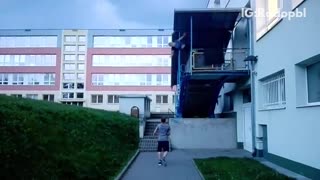 Guy flips off balcony lands in bushes next to other man