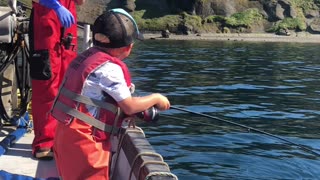 Excited Three-Year-Old Catches a Fish