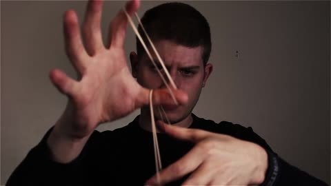 Magician Uses A Rubber Band That Disappears In The Blink Of An Eye