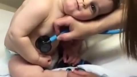 Sweet Baby Boy Rests Head On Nurse's Hand