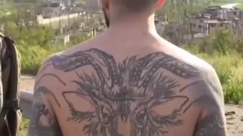 Ukrainian soldier with Nazi tattoos