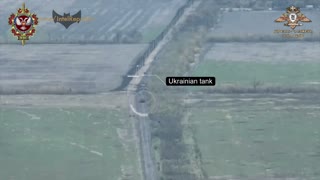 Ukrainian tank drives down middle of road