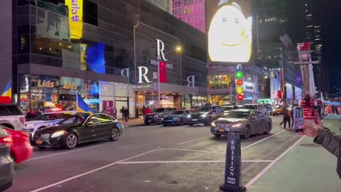 Dozens of vehicles with Ukraine flags rolling through Times Square.