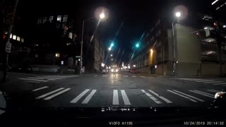 SUV driving down street wrong way