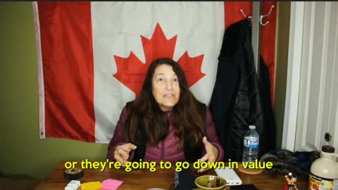 Mom in front of canadian flag invents her own cryptocurrency