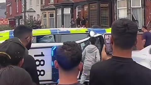 BREAKING NEWS: This is #Leeds in #England. Police car turned over,
