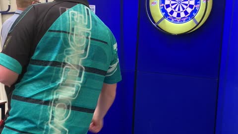 Boy Plays Darts with Professional Player Rob Cross