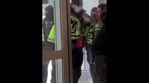 Jackbooted Masked Terror-Police surrounding the Iconic Cafe in Ottawa