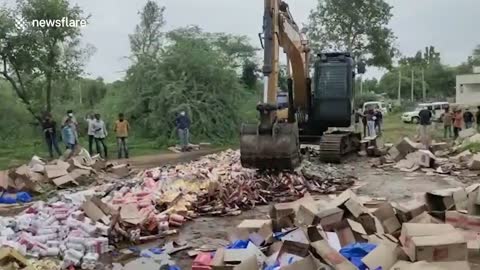 Excavator used to destroy alcohol worth almost $60,000 in western India
