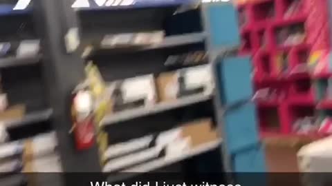 Guy climbs on top of shelf at toy store and jumps into barbie doll display