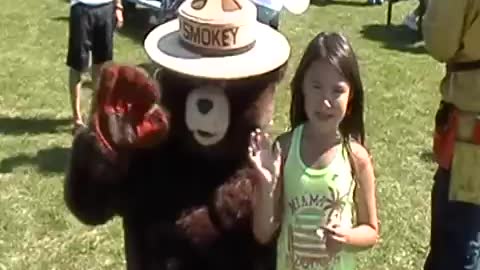 Diane and Smokey The Bear at picnic.