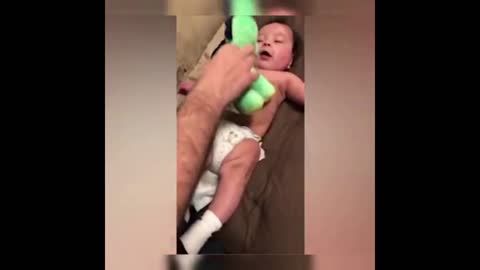 Cute baby playing with parents