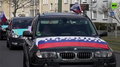 Hundreds of demonstrators in German capital took part in a motorcade denouncing discrimination against the Russian-speaking community
