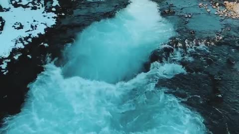 Beautiful Bruarfoss Waterfall Swirls with Glacial Waters