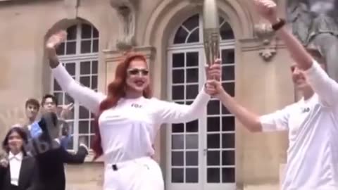 tranny delivers olympic torch in the pedo capitol of the world...