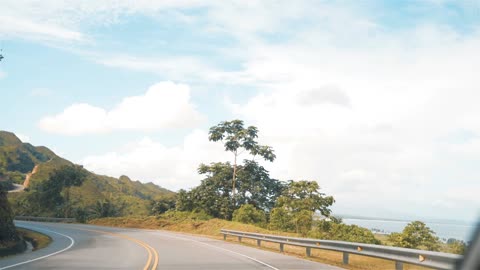 Touring a lake in nature from the top,Abundant trees in a jungle,Highway