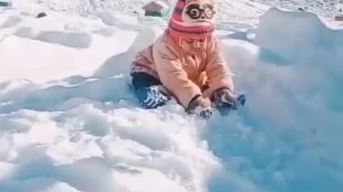 Cute baby play with snow