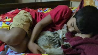 Cute cat sleeping with owner